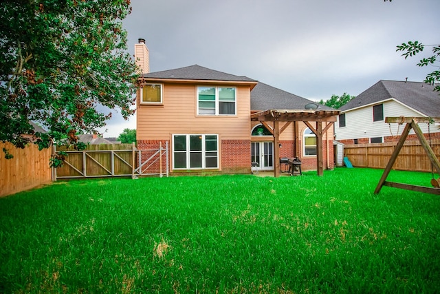 10407 Redwood Dr, Baytown, TX 77523 - back of property with brick siding, a pergola, a chimney, and a playground