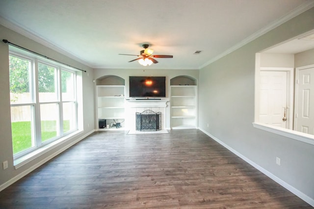 10407 Redwood Dr, Baytown, TX 77523 - unfurnished living room with ornamental molding, baseboards, ceiling fan, a fireplace, and dark wood-style flooring