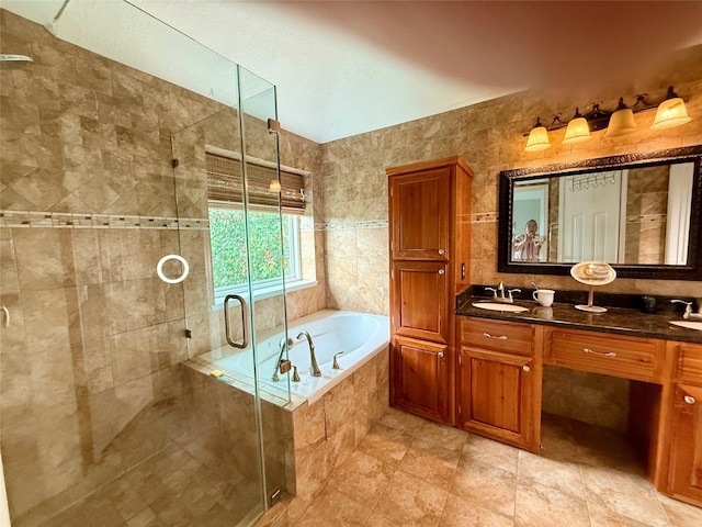 10407 Redwood Dr, Baytown, TX 77523 - full bathroom featuring a garden tub, a shower stall, double vanity, and tile patterned flooring