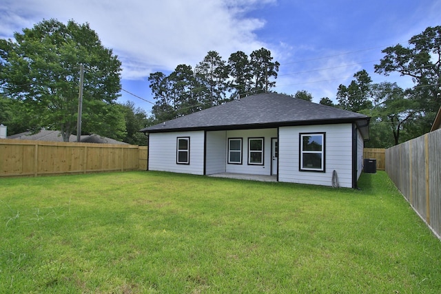 624 Pinewood Dr, Conroe, TX 77385 - rear view of house featuring central air condition unit and roof with shingles