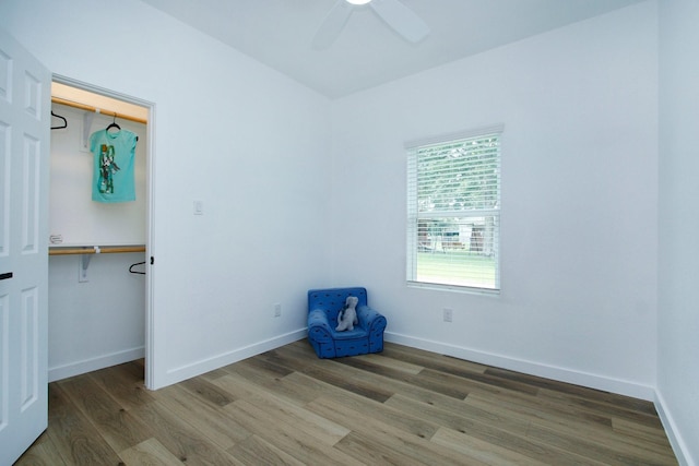 624 Pinewood Dr, Conroe, TX 77385 - unfurnished bedroom with wood finished floors, baseboards, a ceiling fan, and a closet
