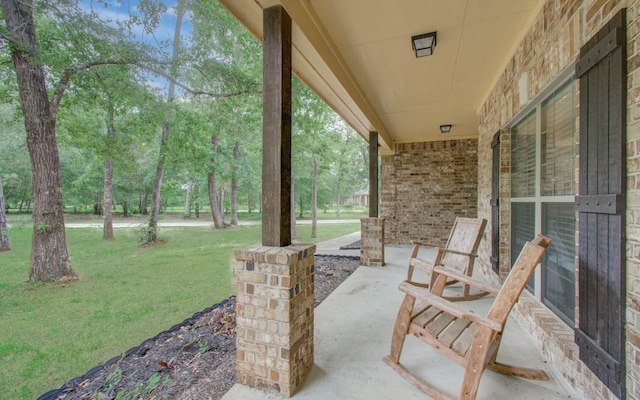 9107 Black Buck Ln, Conroe, TX 77303 - view of patio featuring view of scattered trees