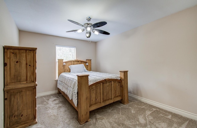 9107 Black Buck Ln, Conroe, TX 77303 - bedroom featuring baseboards, light colored carpet, and a ceiling fan
