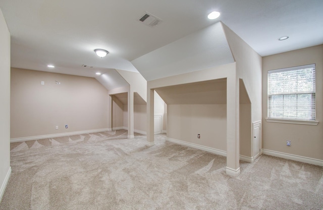 9107 Black Buck Ln, Conroe, TX 77303 - additional living space with light carpet, vaulted ceiling, baseboards, and recessed lighting