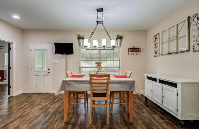 9107 Black Buck Ln, Conroe, TX 77303 - dining room featuring a chandelier, dark wood-style flooring, recessed lighting, and baseboards