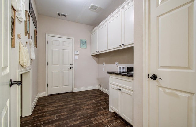 9107 Black Buck Ln, Conroe, TX 77303 - washroom featuring cabinet space, hookup for a washing machine, dark wood-style flooring, and baseboards