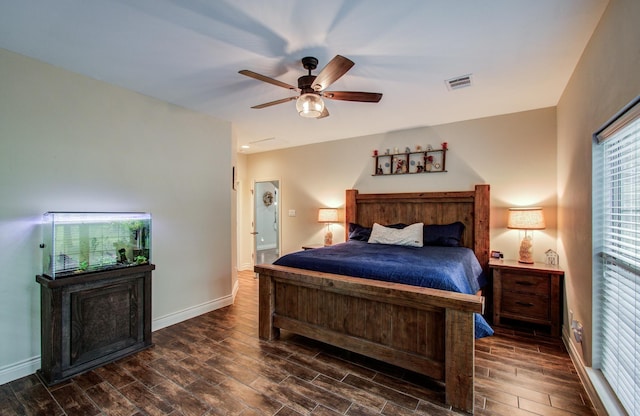 9107 Black Buck Ln, Conroe, TX 77303 - bedroom with dark wood finished floors, baseboards, and a ceiling fan