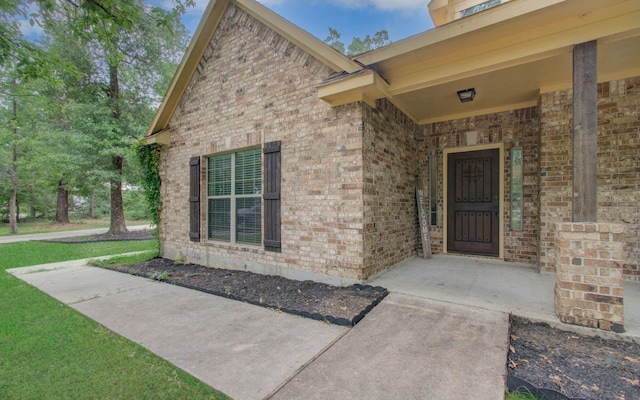 9107 Black Buck Ln, Conroe, TX 77303 - entrance to property with brick siding and a lawn