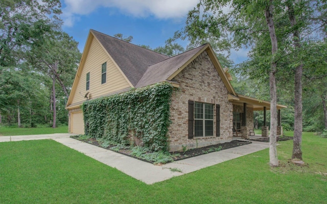 9107 Black Buck Ln, Conroe, TX 77303 - view of property exterior with a lawn, brick siding, a garage, and a shingled roof
