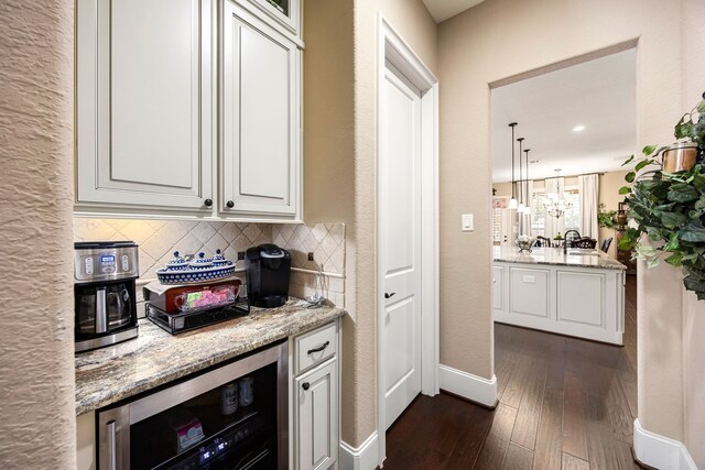 2803 Chester Knoll Ct, Katy, TX 77494 - bar featuring beverage cooler, backsplash, dark wood-type flooring, baseboards, and decorative light fixtures