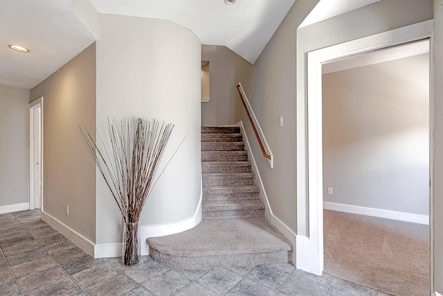 5229 Larkin St, Houston, TX 77007 - stairway with baseboards, recessed lighting, carpet floors, vaulted ceiling, and tile patterned flooring