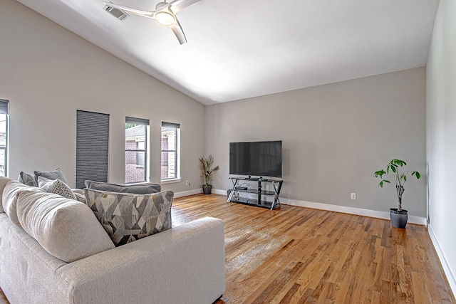 5229 Larkin St, Houston, TX 77007 - living area featuring light wood-style flooring, a ceiling fan, baseboards, and high vaulted ceiling