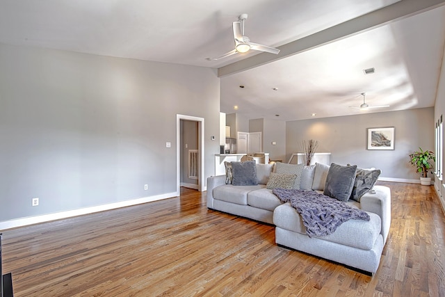 5229 Larkin St, Houston, TX 77007 - living area featuring ceiling fan, baseboards, and light wood-style flooring