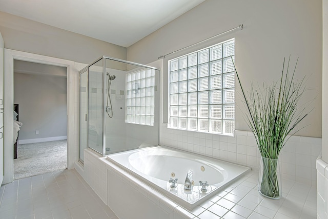 5229 Larkin St, Houston, TX 77007 - full bathroom featuring a garden tub, a shower stall, plenty of natural light, and tile patterned flooring