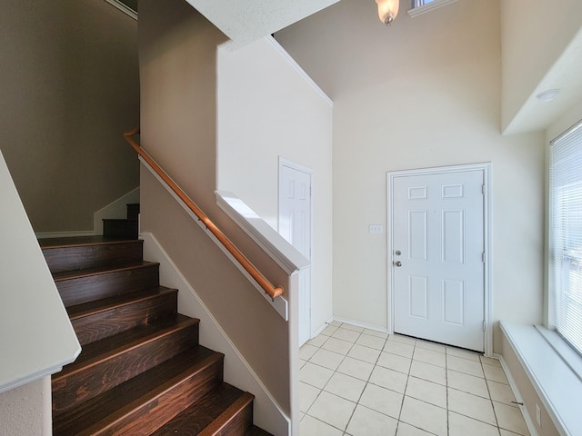 6135 Shelbourne Park Ln, Houston, TX 77084 - entryway featuring light tile patterned floors, stairs, and healthy amount of natural light