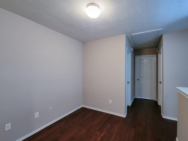 6135 Shelbourne Park Ln, Houston, TX 77084 - unfurnished room featuring attic access, wood finished floors, and baseboards