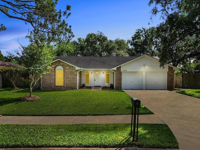 16602 Hibiscus Ln, Friendswood, TX 77546 - ranch-style home with an attached garage, driveway, and brick siding