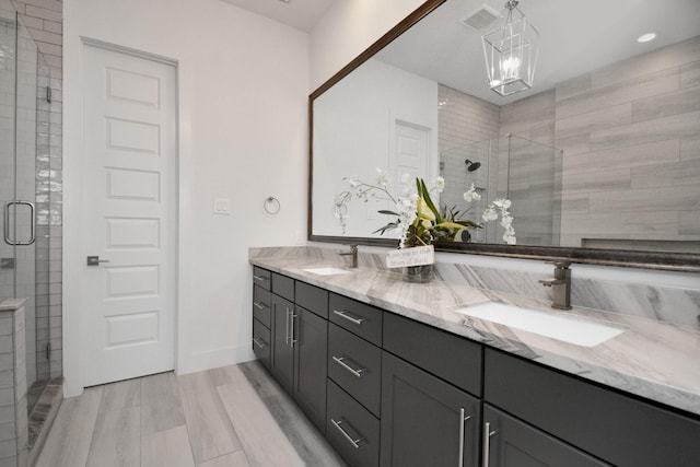 2917 Dallas St, Houston, TX 77003 - full bathroom featuring double vanity, a stall shower, and recessed lighting