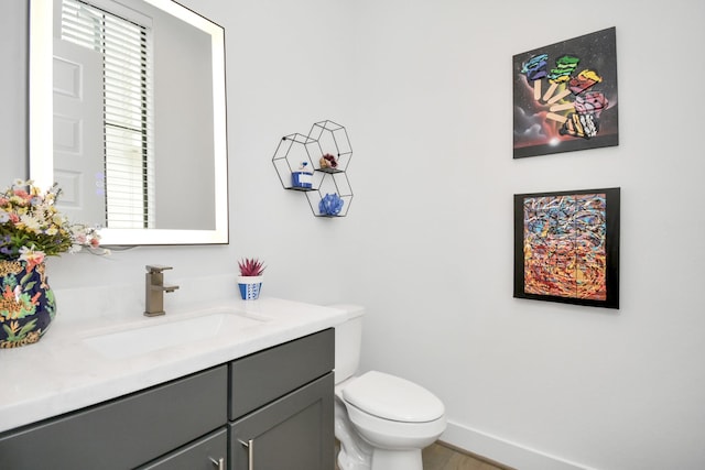 2917 Dallas St, Houston, TX 77003 - bathroom with vanity, toilet, and wood finished floors