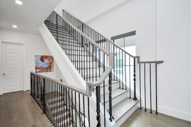 2917 Dallas St, Houston, TX 77003 - stairs featuring wood finished floors, recessed lighting, and baseboards
