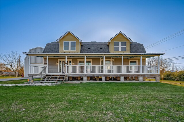 206 S Idaho St, La Porte, TX 77571 - view of front of house featuring a shingled roof, a porch, and a front lawn