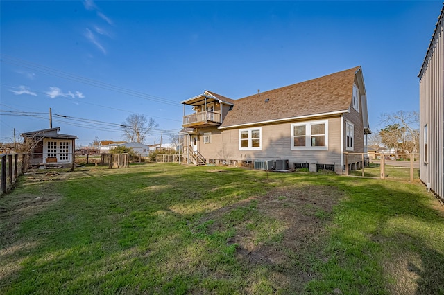 206 S Idaho St, La Porte, TX 77571 - back of property featuring a balcony, roof with shingles, and central air condition unit