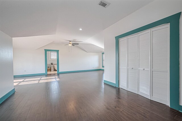 206 S Idaho St, La Porte, TX 77571 - unfurnished living room with ceiling fan, baseboards, dark wood-style flooring, and lofted ceiling