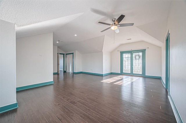 206 S Idaho St, La Porte, TX 77571 - unfurnished living room featuring vaulted ceiling, ceiling fan, baseboards, and wood finished floors