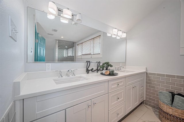 206 S Idaho St, La Porte, TX 77571 - bathroom featuring double vanity and tiled shower