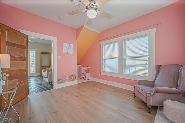 206 S Idaho St, La Porte, TX 77571 - living area with wood finished floors, baseboards, and ceiling fan