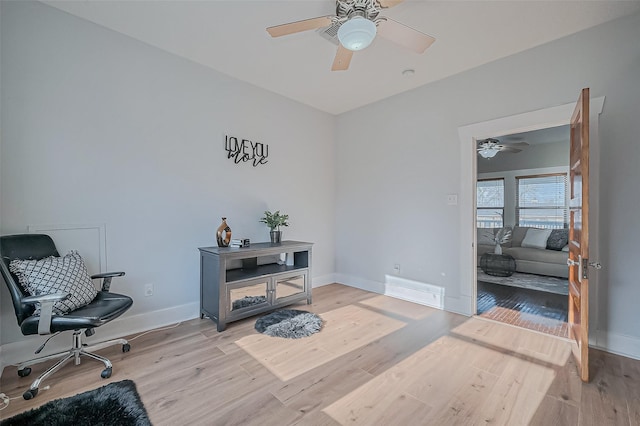 206 S Idaho St, La Porte, TX 77571 - office with light wood-style floors, ceiling fan, and baseboards