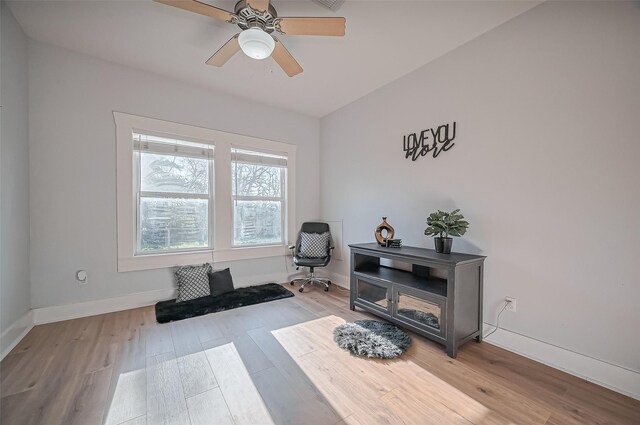 206 S Idaho St, La Porte, TX 77571 - living area featuring wood finished floors, a ceiling fan, and baseboards