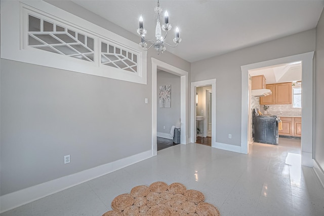 206 S Idaho St, La Porte, TX 77571 - unfurnished dining area featuring a chandelier and baseboards