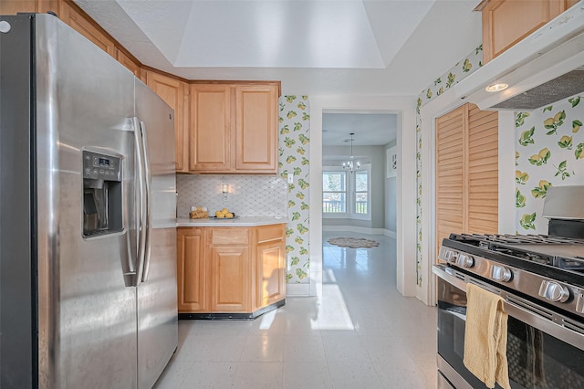 206 S Idaho St, La Porte, TX 77571 - kitchen featuring stainless steel appliances, under cabinet range hood, a chandelier, backsplash, and light countertops