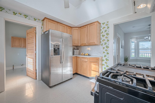 206 S Idaho St, La Porte, TX 77571 - kitchen with stainless steel fridge with ice dispenser, gas stove, light brown cabinetry, light countertops, and baseboards