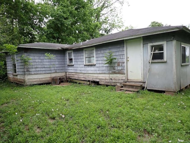 9706 Fm-102, Wharton, TX 77488 - rear view of property with entry steps and a yard