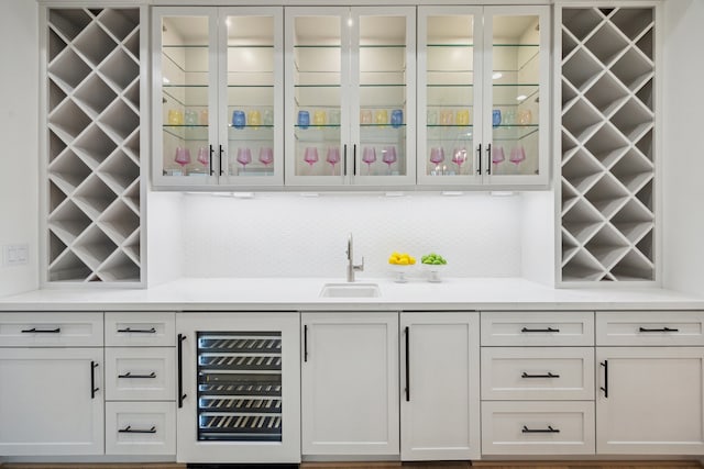 1203 Bomar St, Houston, TX 77006 - indoor wet bar featuring beverage cooler and backsplash