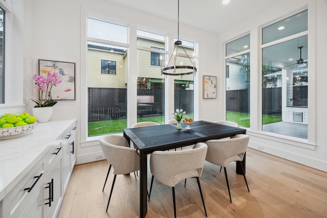 1203 Bomar St, Houston, TX 77006 - dining area with light wood-style flooring, healthy amount of natural light, recessed lighting, and baseboards