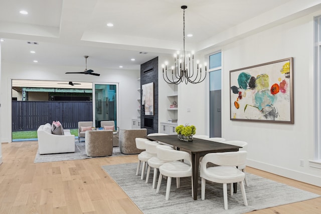 1203 Bomar St, Houston, TX 77006 - dining area with light wood-type flooring, recessed lighting, a chandelier, a ceiling fan, and built in shelves
