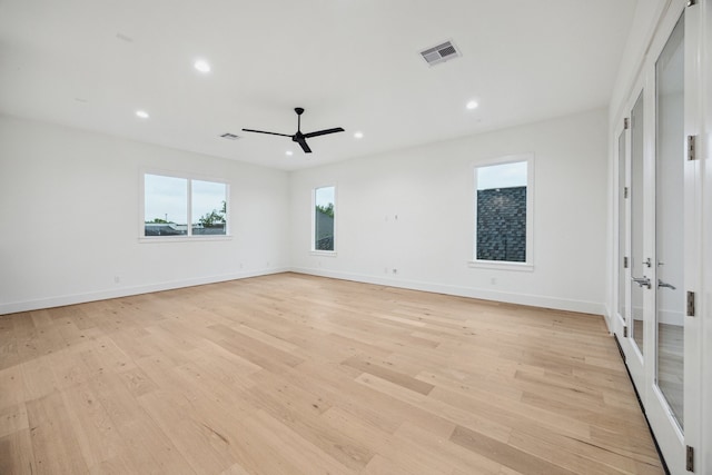 1203 Bomar St, Houston, TX 77006 - empty room with ceiling fan, french doors, light wood finished floors, recessed lighting, and baseboards