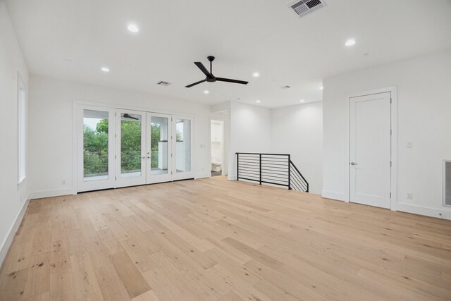 1203 Bomar St, Houston, TX 77006 - unfurnished living room with light wood-style flooring, ceiling fan, recessed lighting, and baseboards
