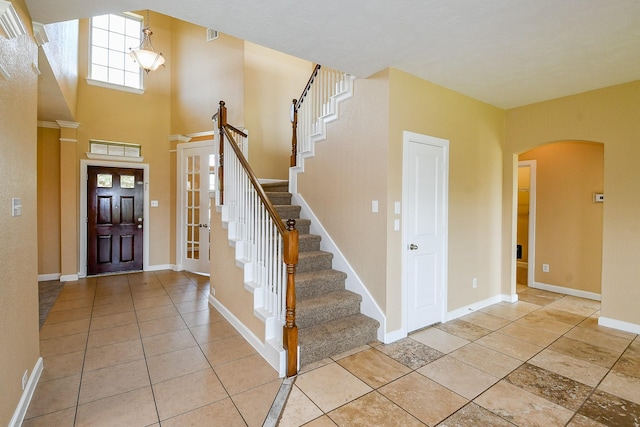 2123 Witham Park Ln, Fresno, TX 77545 - entryway with arched walkways, stairs, and baseboards