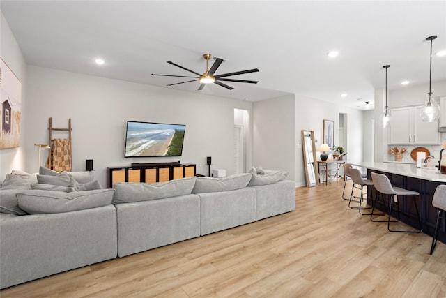 18631 Joyous Ln, Cypress, TX 77433 - living room featuring a ceiling fan, light wood-type flooring, and recessed lighting