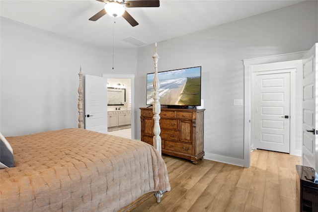 18631 Joyous Ln, Cypress, TX 77433 - bedroom with light wood-style flooring, connected bathroom, a ceiling fan, and baseboards