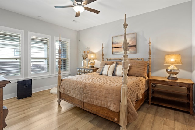 18631 Joyous Ln, Cypress, TX 77433 - bedroom featuring light wood-style flooring, baseboards, and ceiling fan