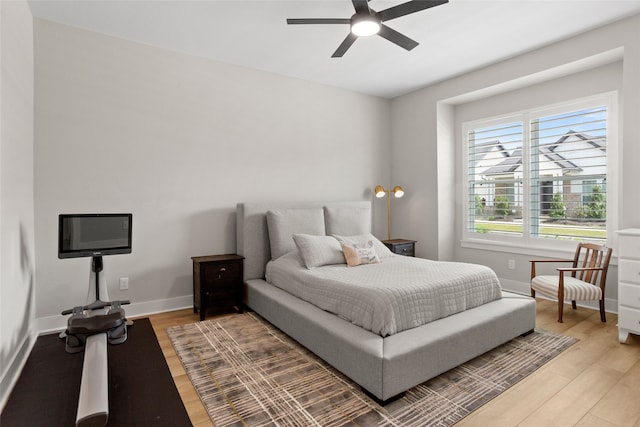 18631 Joyous Ln, Cypress, TX 77433 - bedroom featuring light wood finished floors, baseboards, and ceiling fan