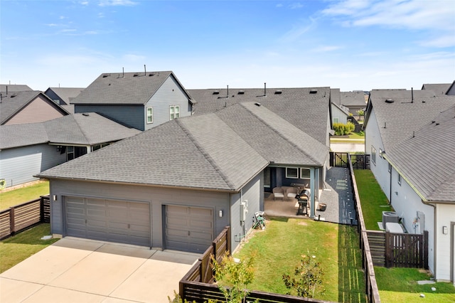 18631 Joyous Ln, Cypress, TX 77433 - view of front of home featuring a garage, concrete driveway, a residential view, and a shingled roof