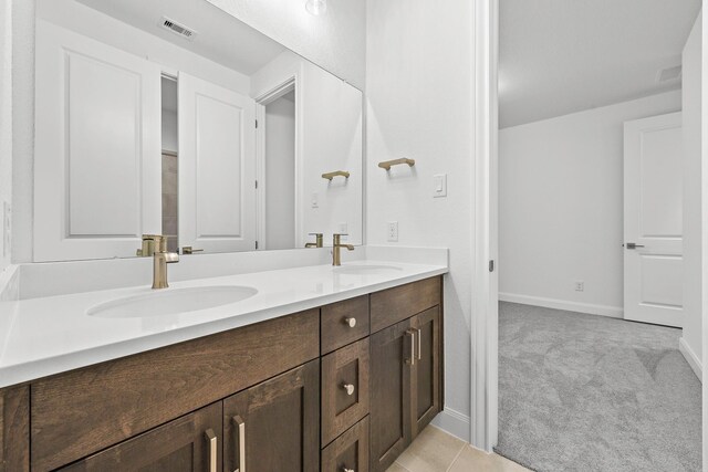 836 Laguna Green Ln, Katy, TX 77493 - bathroom with double vanity and baseboards
