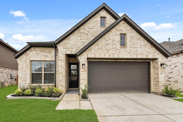 836 Laguna Green Ln, Katy, TX 77493 - french country style house with concrete driveway, a front yard, and brick siding
