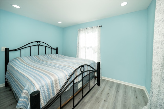 570 Fm 232, Crockett, TX 75835 - bedroom with baseboards, wood finished floors, and recessed lighting